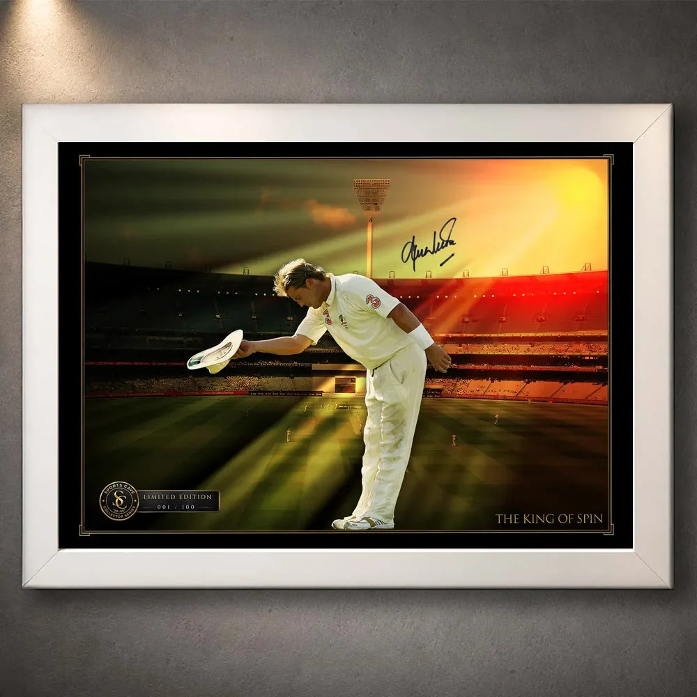 White framed Shane Warne cricket wall art featuring his bowing tribute against a golden stadium backdrop.