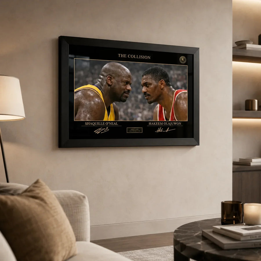 Shaq vs Hakeem framed basketball wall art displayed on a warm living room wall with black frame and glass