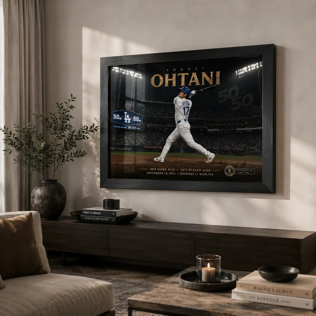 Framed Shohei Ohtani baseball wall art displayed above a dark timber console in a softly lit modern living room.