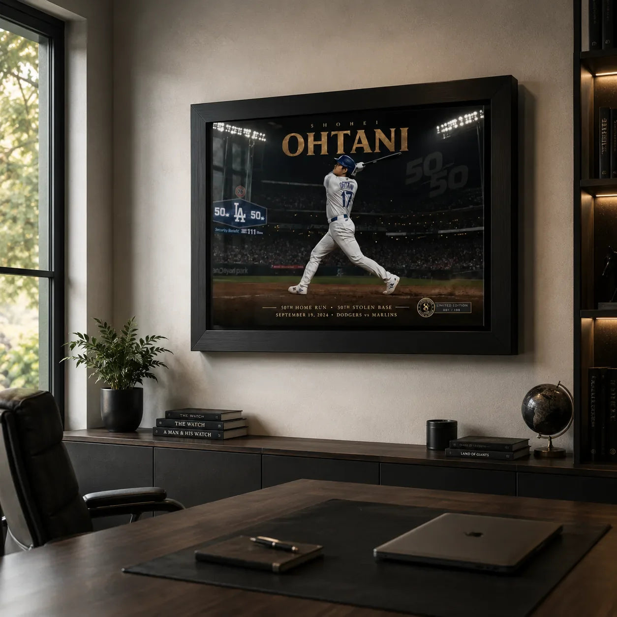 Shohei Ohtani framed baseball wall art displayed above a desk in a dark modern home office with warm shelving lights.