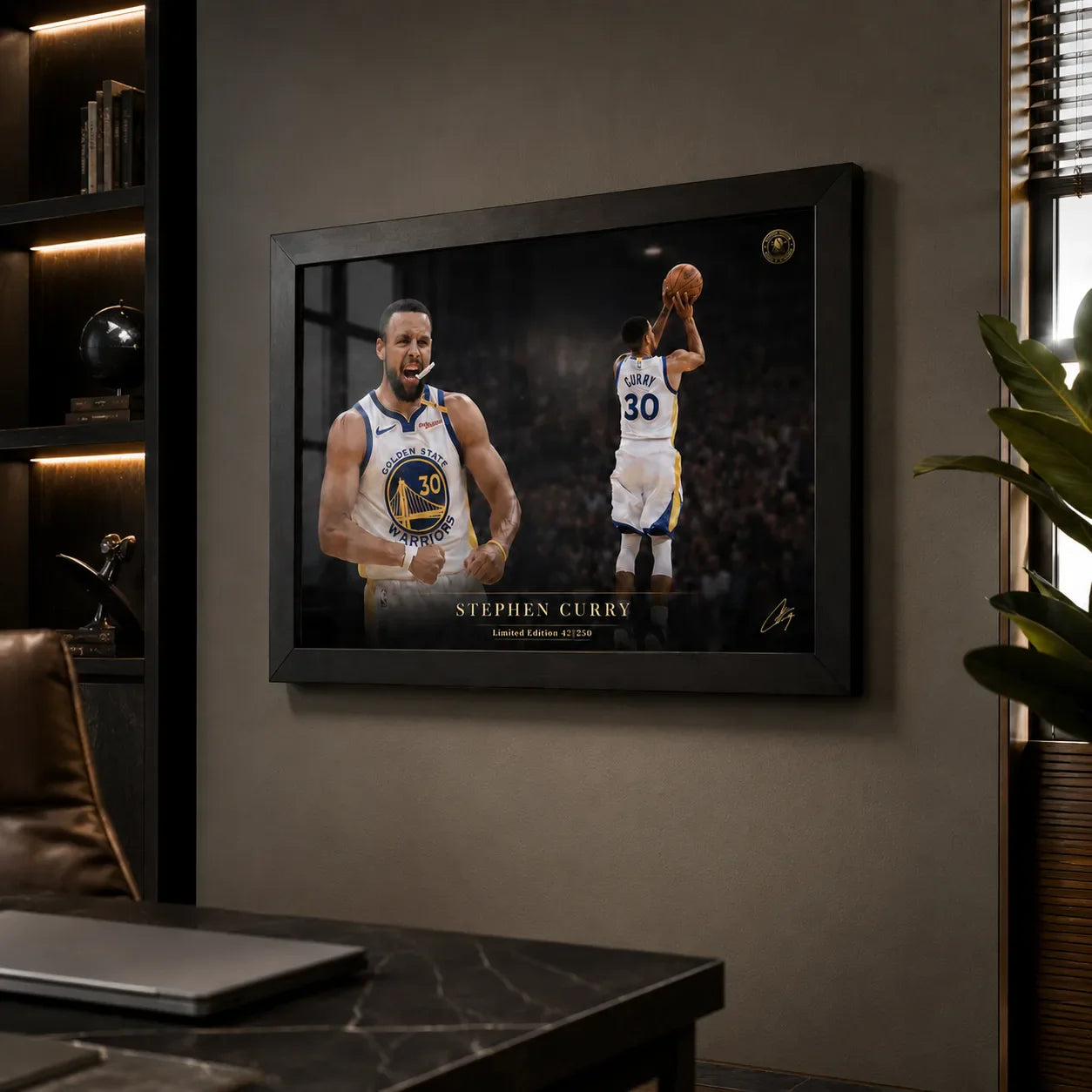 Black framed Stephen Curry wall art displayed in a moody office with shelving, desk, and window light.