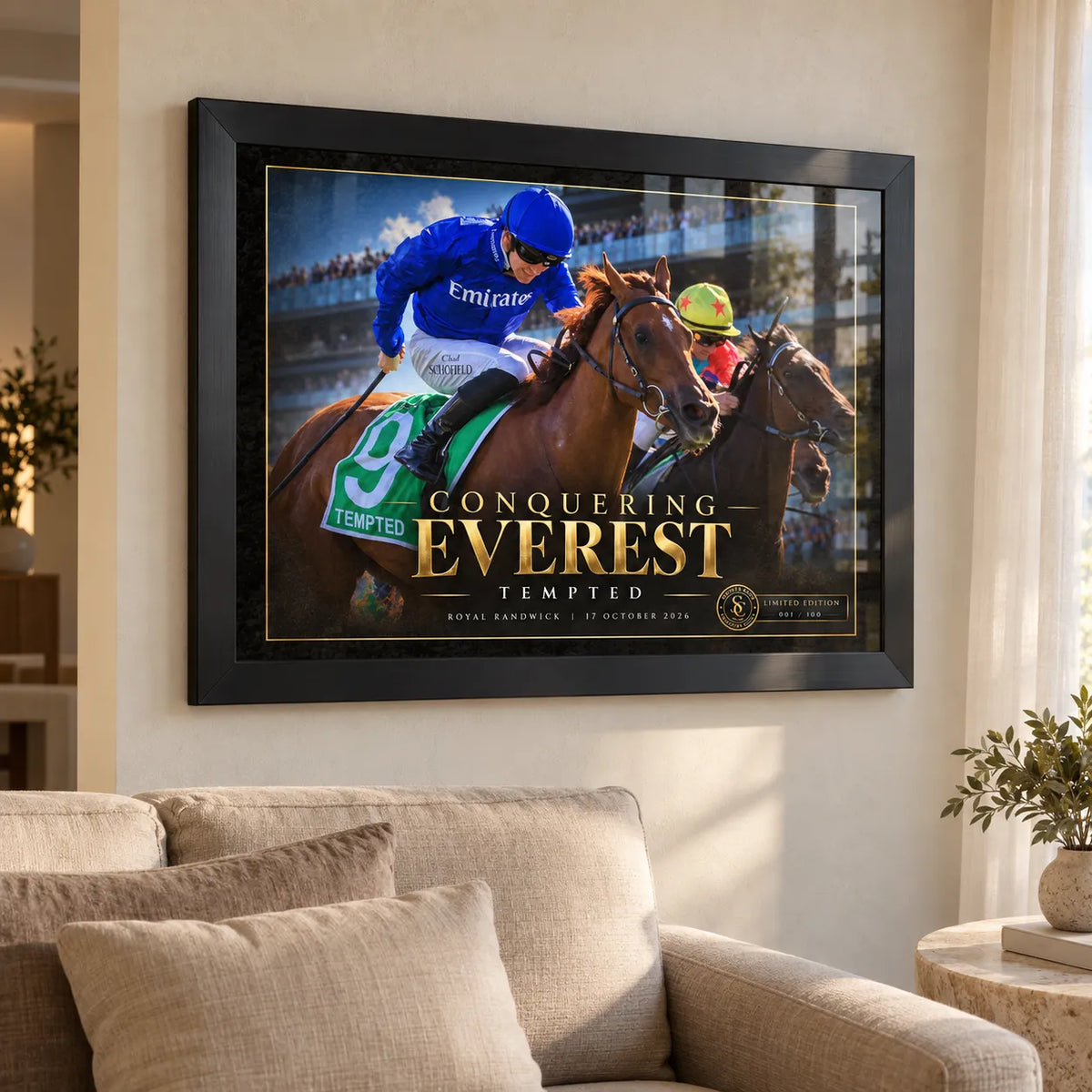 Tempted Conquering Everest framed collector edition mounted above a cream sofa in a bright living room