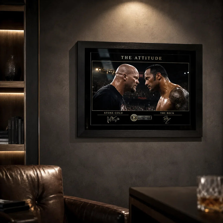 The Attitude Stone Cold vs The Rock framed wall art mounted on a dark feature wall in a premium leather-chair man cave.