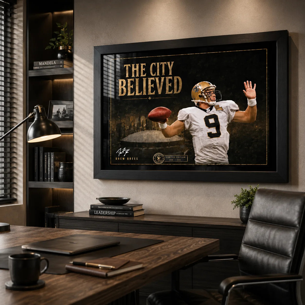 The City Believed NFL wall art displayed in a warm executive office, black framed above a timber credenza and desk.