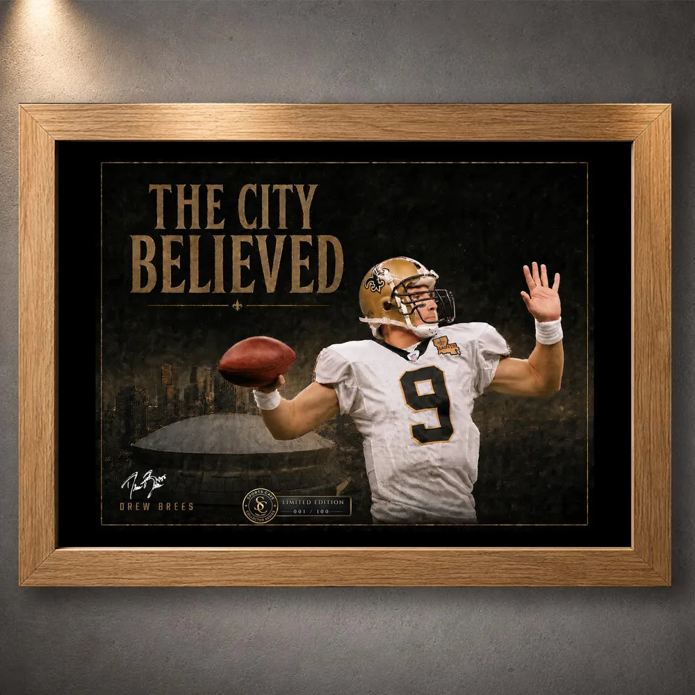 Oak framed The City Believed New Orleans football wall art featuring a quarterback, black-and-gold artwork and stadium backdrop.