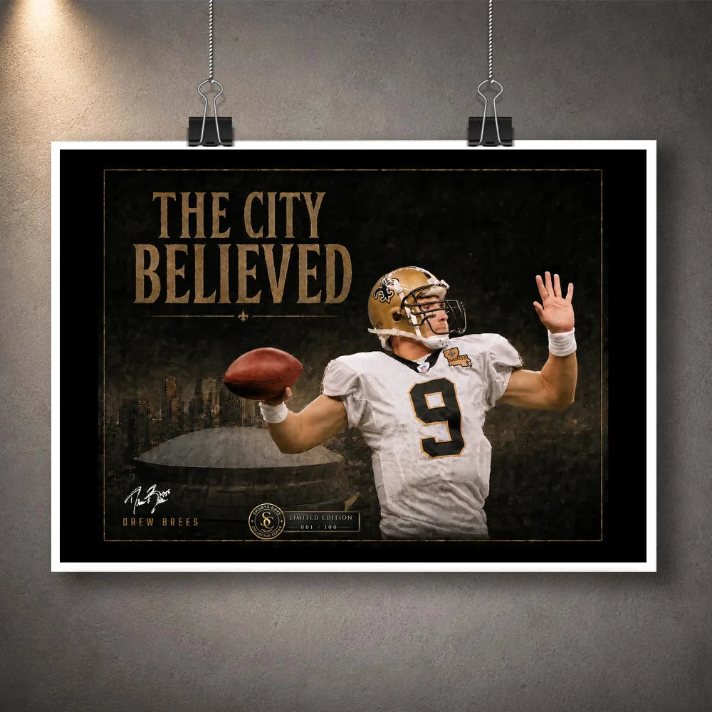 Unframed The City Believed New Orleans NFL wall art print featuring a quarterback, gold title typography and stadium backdrop.