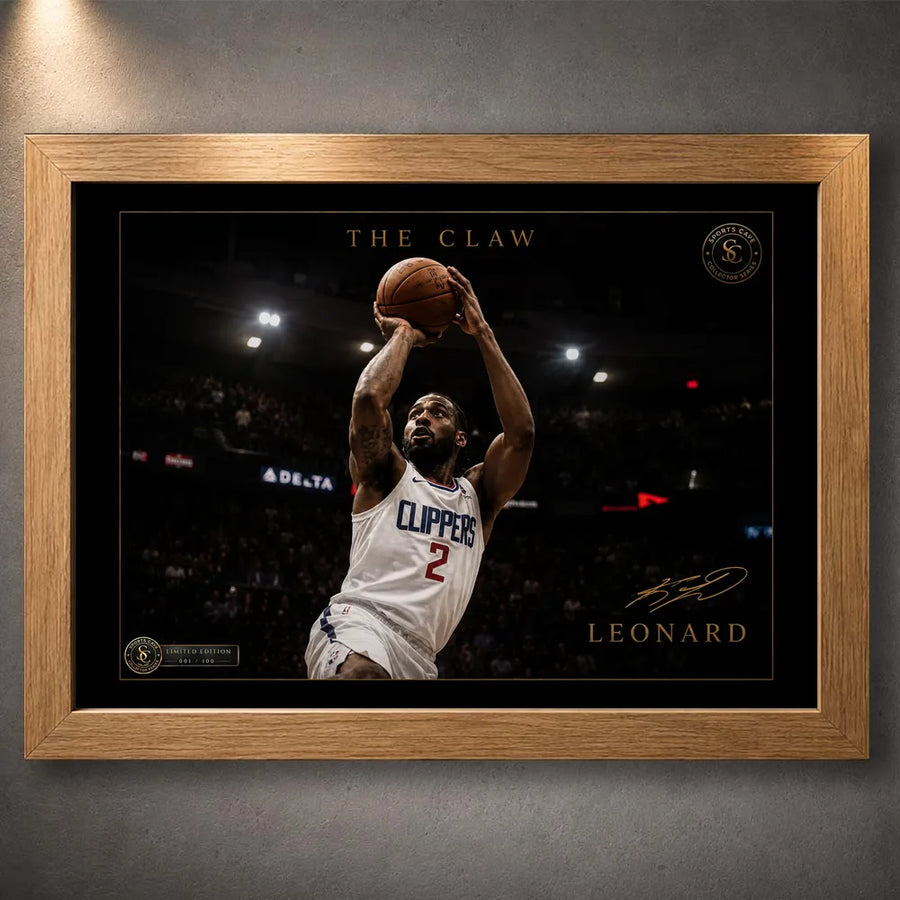 Kawhi Leonard The Claw basketball wall art in an oak frame, shown as a close-up product display on a dark grey wall.