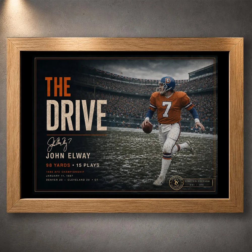 Oak framed John Elway wall art featuring The Drive tribute, shown against a neutral wall for a warmer collector presentation.