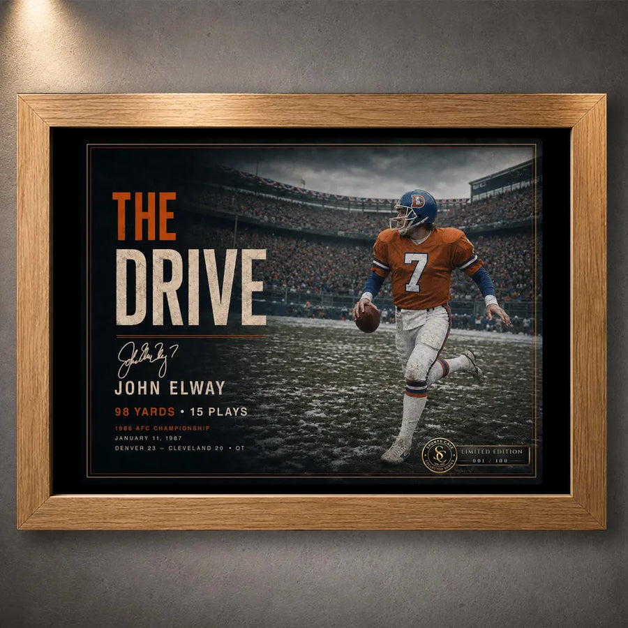 Oak framed John Elway wall art featuring The Drive tribute, shown against a neutral wall for a warmer collector presentation.