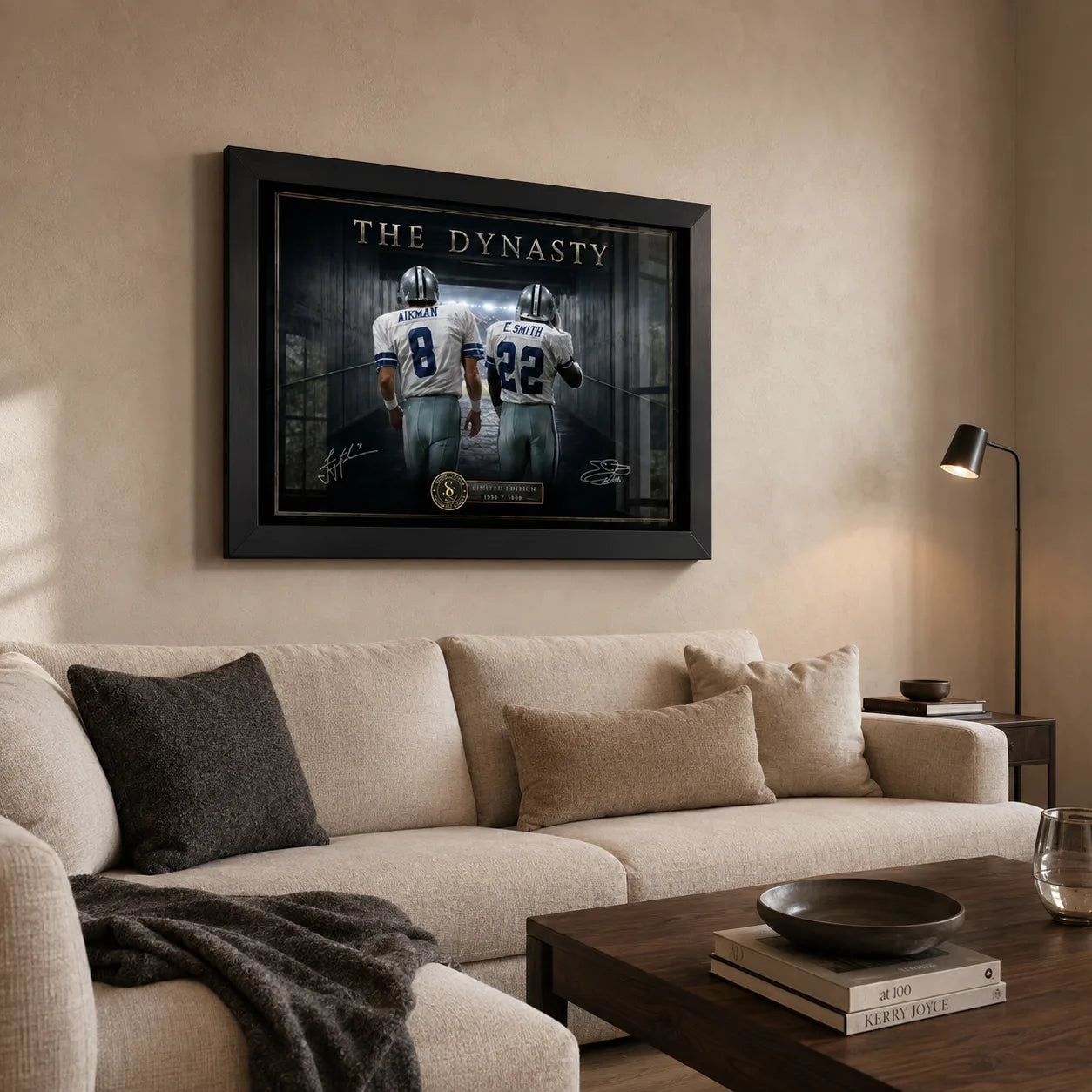 Aikman and Smith wall art in a warm neutral living room above a cream sofa, displayed in a premium black frame.
