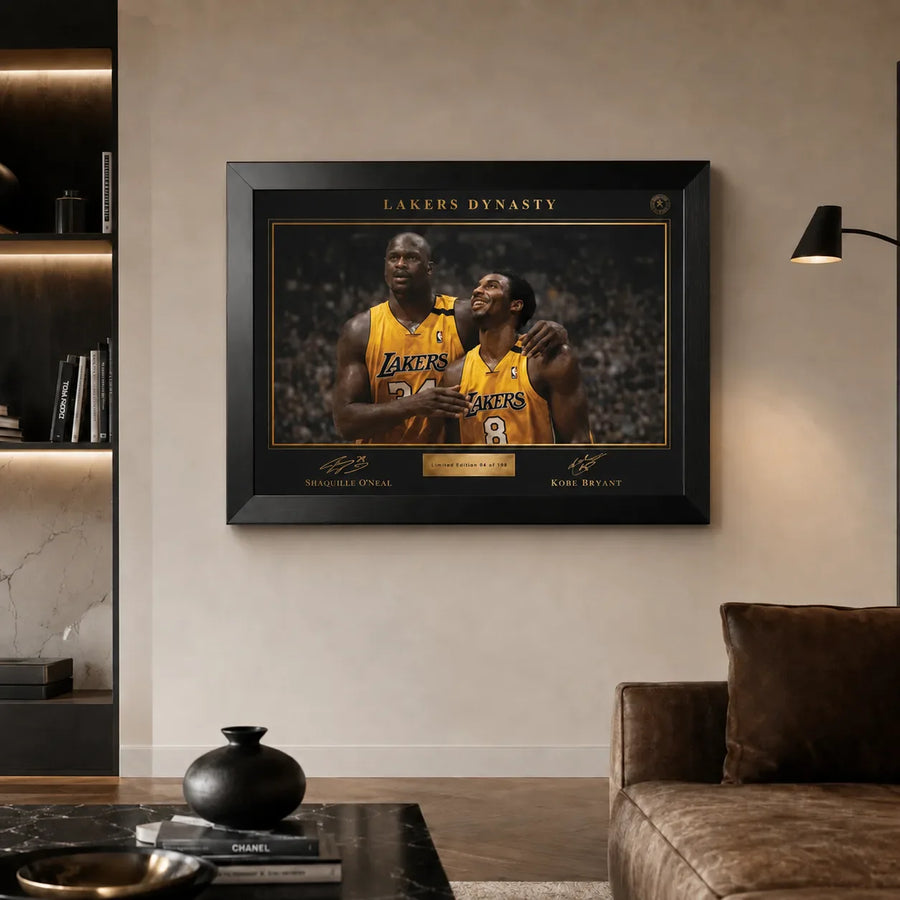 Lakers Dynasty NBA wall art in a premium living room with black frame, warm lighting and leather sofa.