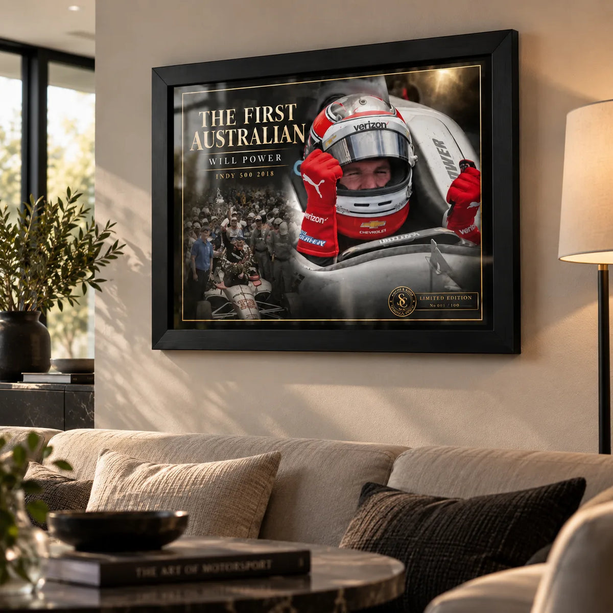 Will Power wall art in a bright modern living room, shown in a black frame above a neutral sofa and coffee table.
