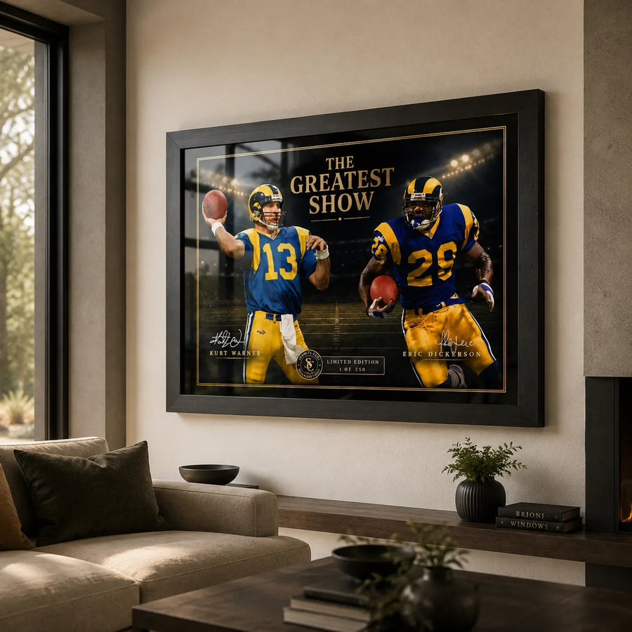 The Greatest Show NFL wall art displayed in a contemporary living room, featuring Kurt Warner and Marshall Faulk in a black frame.