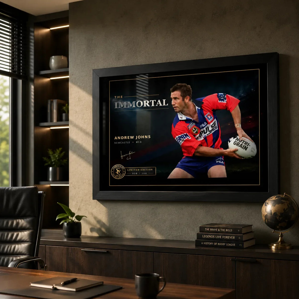 Black framed Andrew Johns wall art displayed in a modern office, styled as rugby league collector artwork above dark timber cabinetry.