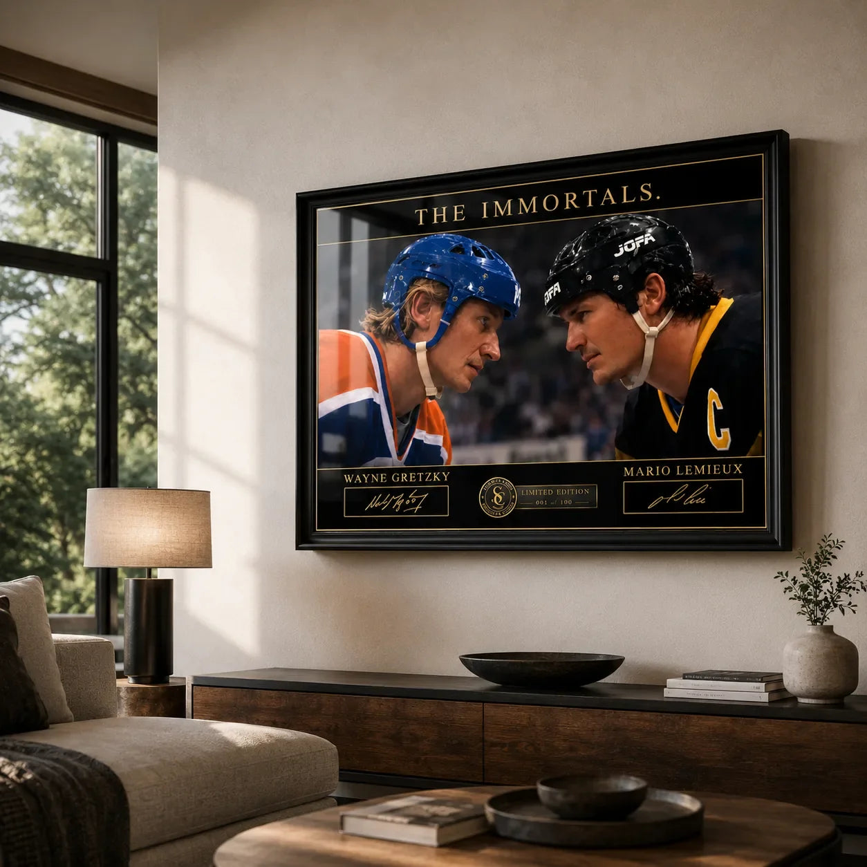 Black framed Wayne Gretzky and Mario Lemieux hockey wall art displayed above a timber console in a bright modern living room.