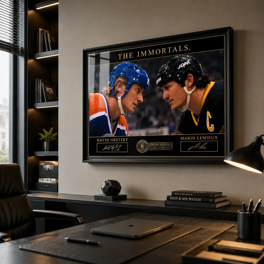 Black framed Gretzky vs Lemieux hockey wall art mounted behind a desk in a modern executive office.