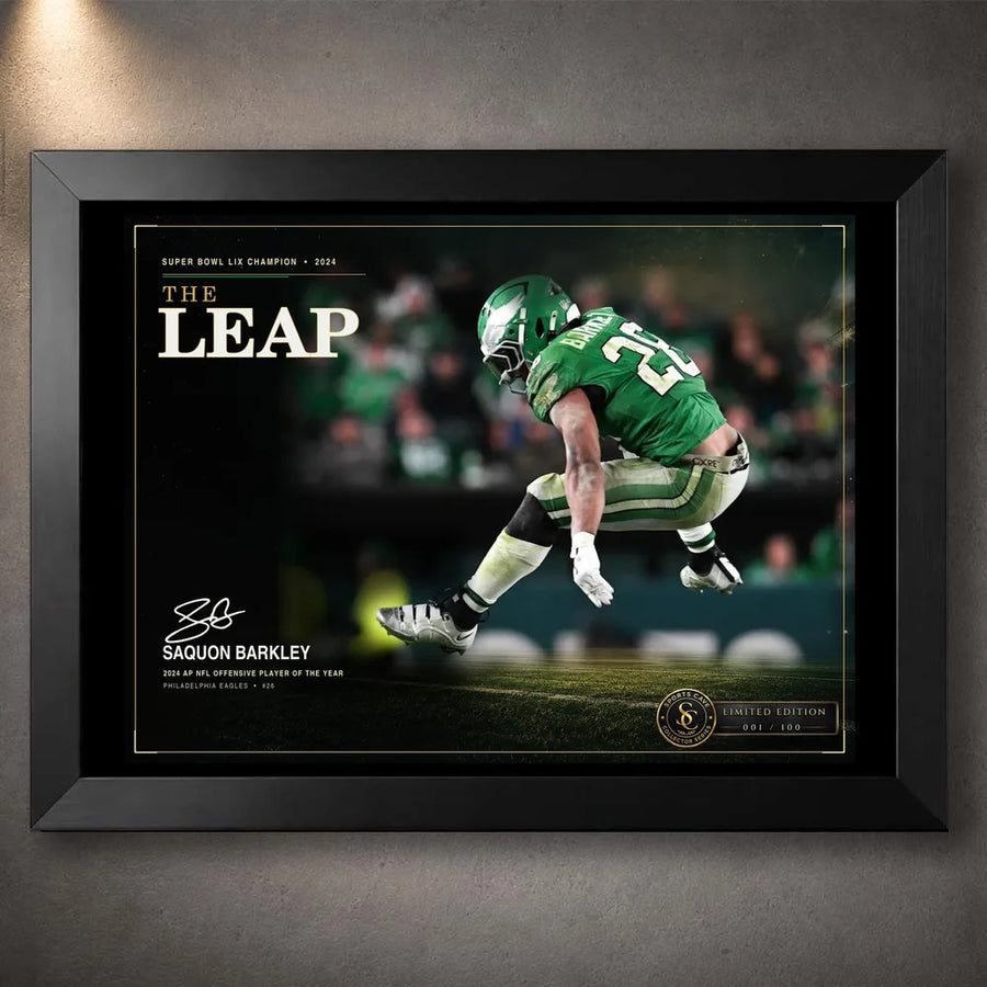 Black framed Saquon Barkley wall art featuring The Leap design in Philadelphia green for an NFL collector display.