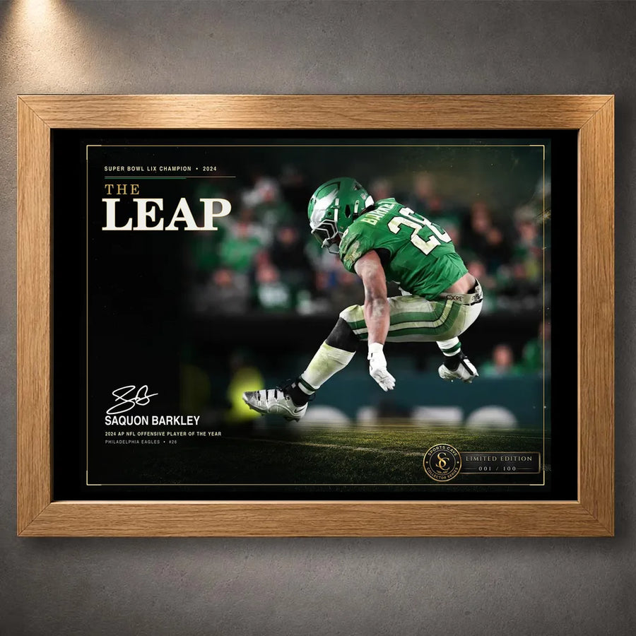 Oak framed The Leap Saquon Barkley wall art featuring the Philadelphia green football design.