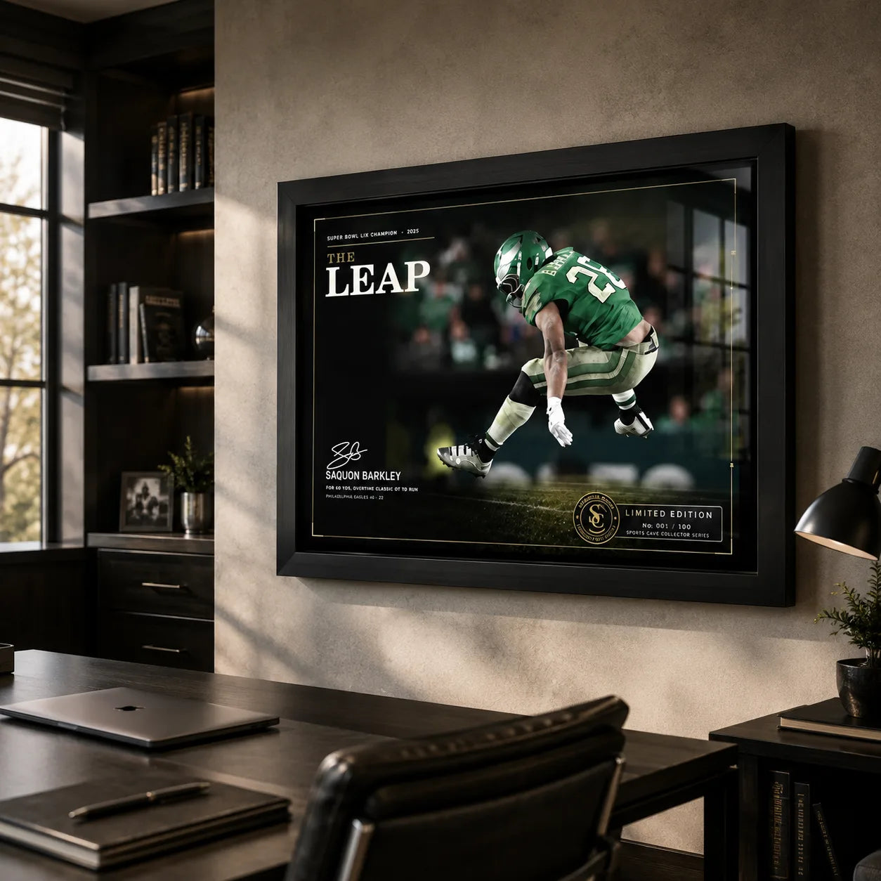 The Leap Saquon Barkley football wall art displayed in a modern office above a dark desk.