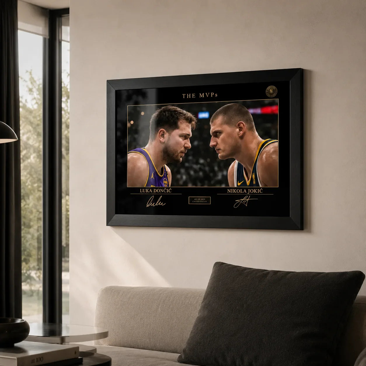Black framed sports wall art displayed above a sofa in a modern living room with soft natural light