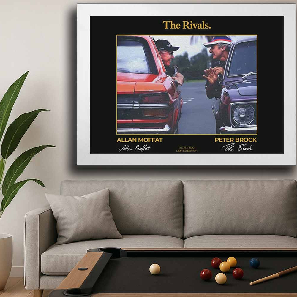 Limited edition framed sports art of Peter Brock and Allan Moffat titled 'The Rivals,' displayed in a modern man cave with a white frame — perfect for Australian motorsport fans seeking premium sports collectibles or man cave wall décor.