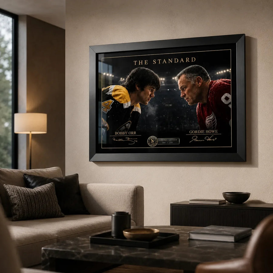 Black-framed Bobby Orr vs Gordie Howe hockey wall art displayed in a warm contemporary living room.