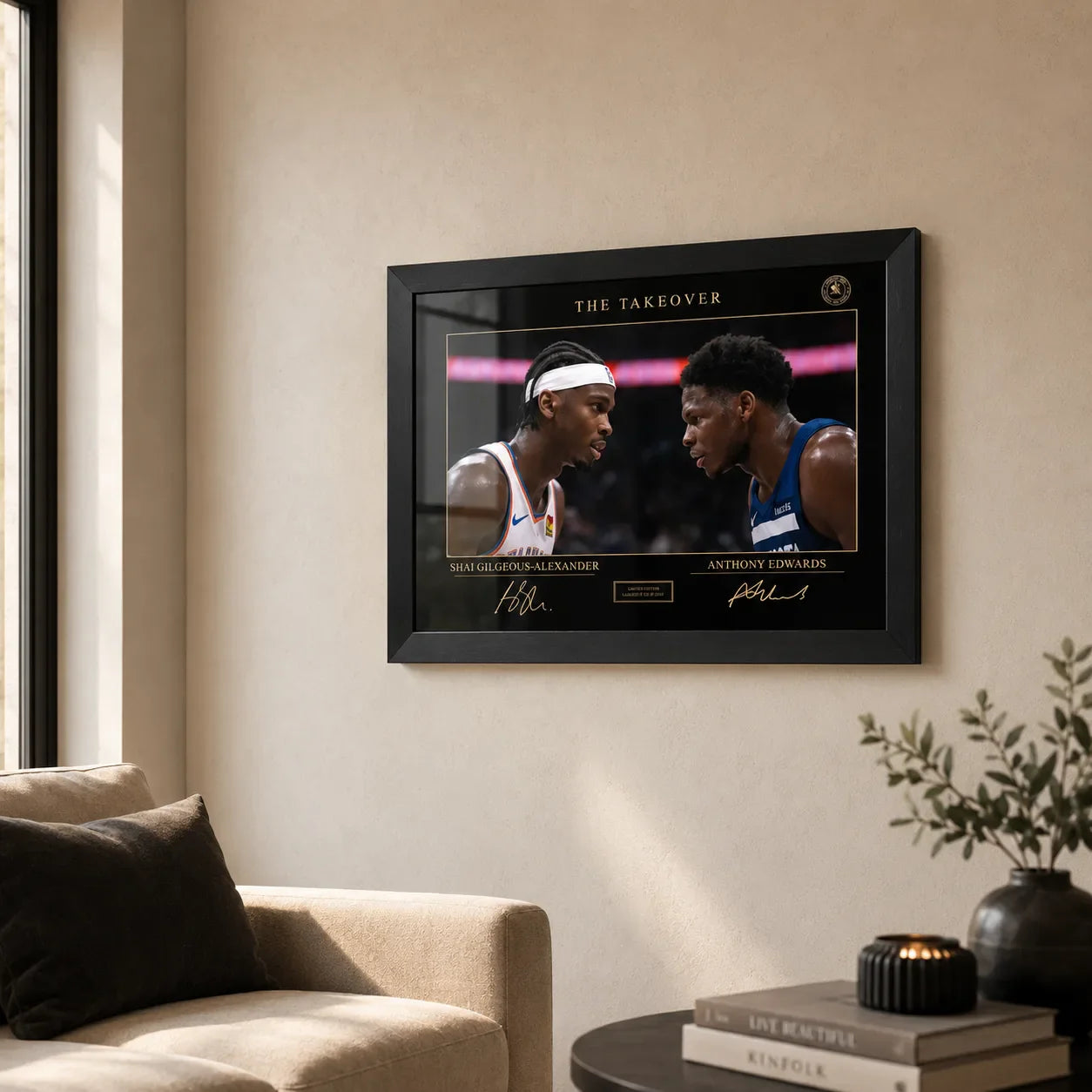 The Take Over basketball wall art in a black frame displayed on a warm neutral living room wall.