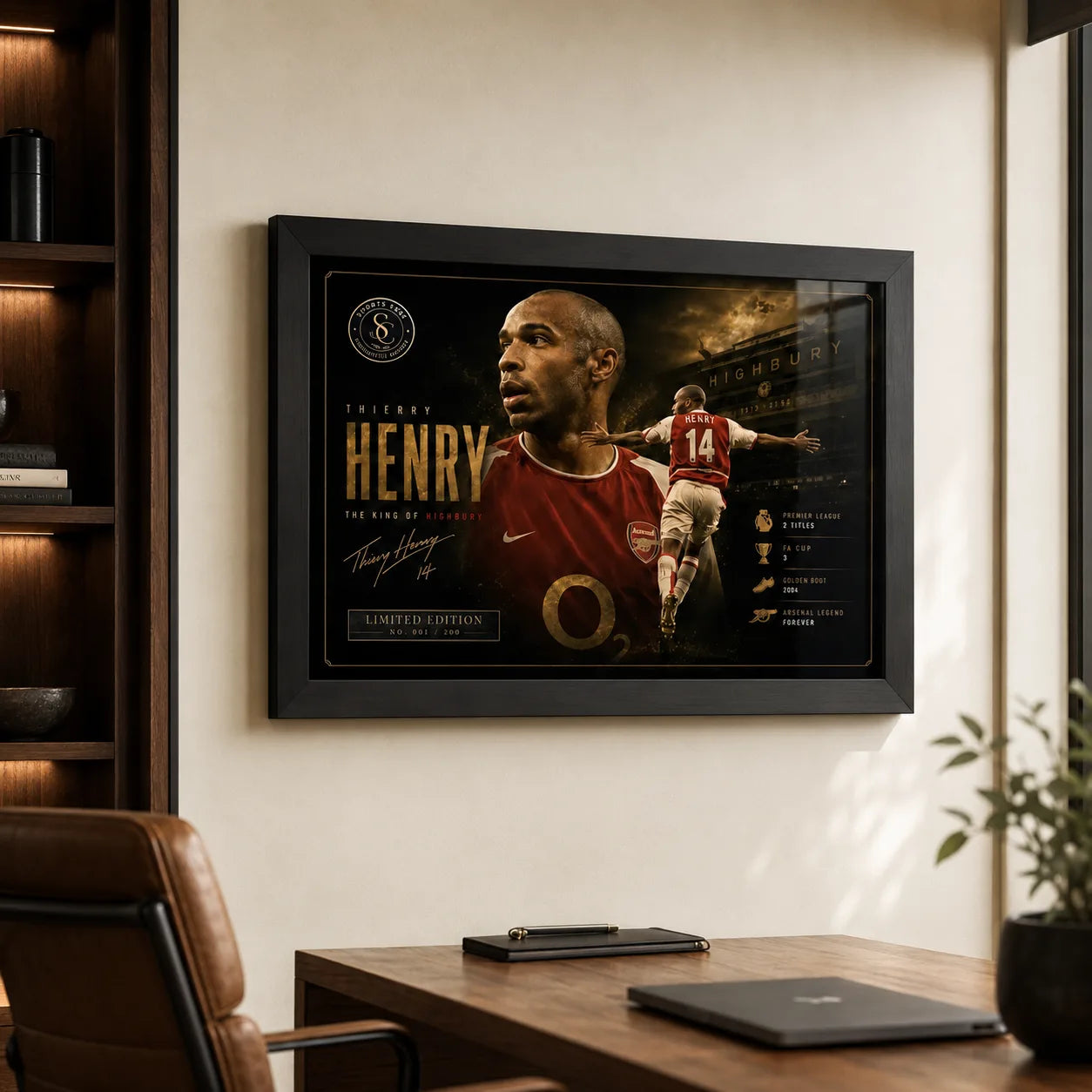 Thierry Henry Arsenal sports wall art in a black frame displayed above a desk in a modern office.