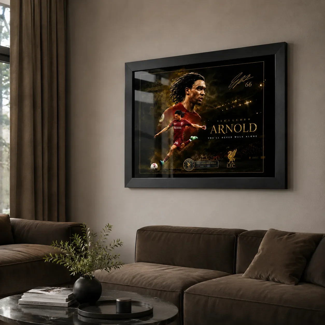Trent Alexander-Arnold soccer wall art in a black frame displayed in a neutral living room.