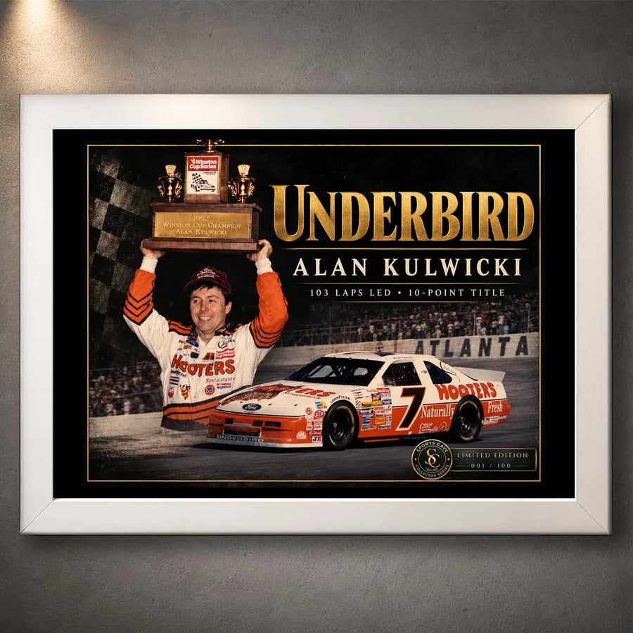 White framed Alan Kulwicki Underbird NASCAR wall art depicting his trophy celebration and number 7 stock car.