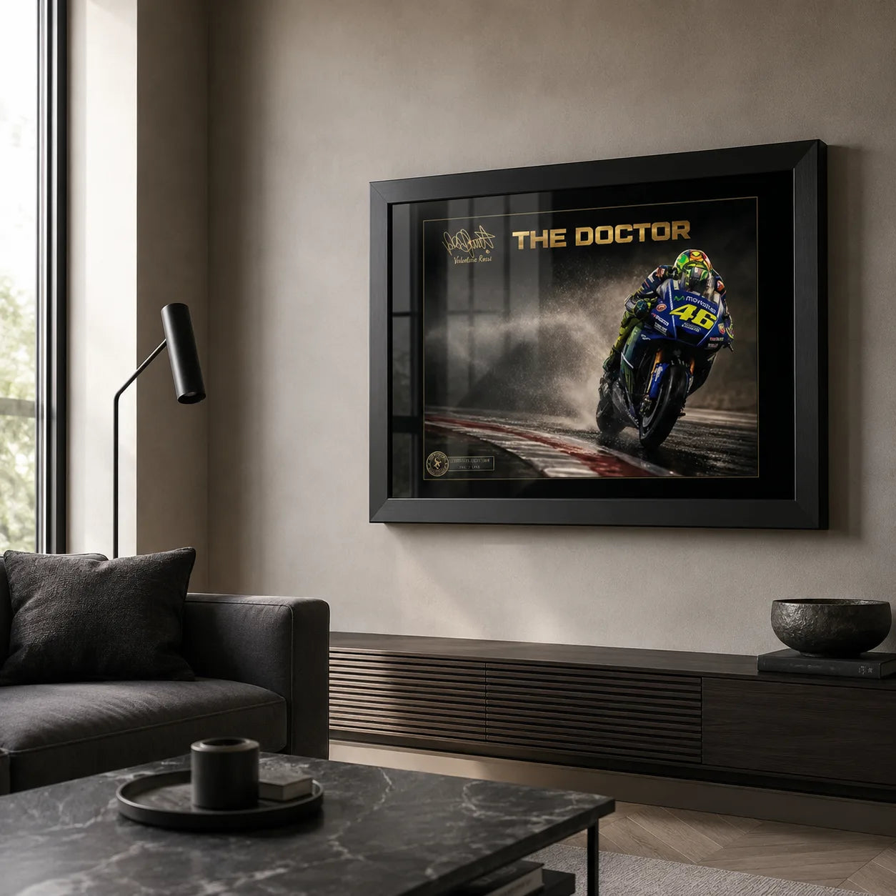 Valentino Rossi The Doctor wall art in a black frame displayed in a modern neutral living room.