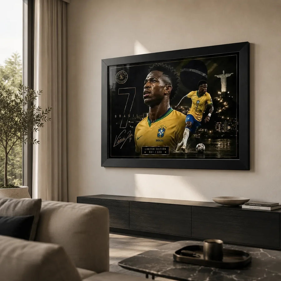 Black-framed Vinicius Junior Brazil wall art displayed in a bright modern living room above a dark timber cabinet.