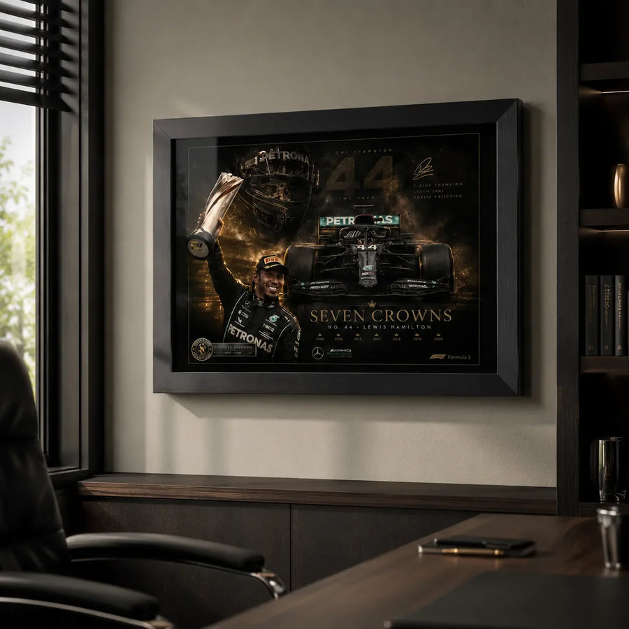 Framed motorsport wall art displayed in a premium home office with dark shelving, desk styling and natural light.