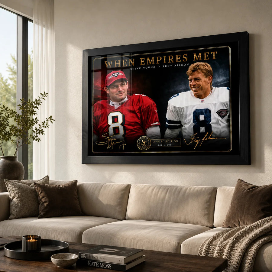 When Empires Met Steve Young and Troy Aikman wall art displayed above a neutral sofa in a bright living room.