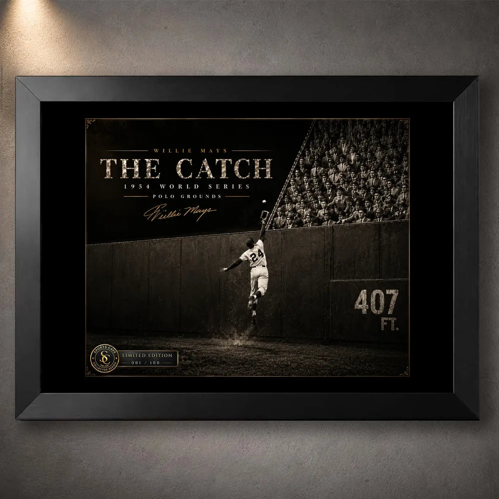 Willie Mays The Catch baseball wall art shown in a premium black frame against a softly lit concrete wall.