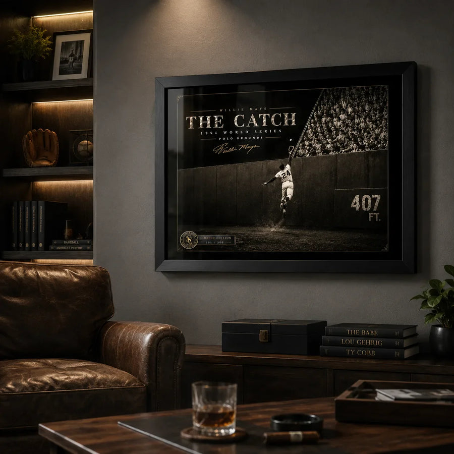 Willie Mays The Catch framed baseball wall art mounted in a dark premium man cave with leather seating.