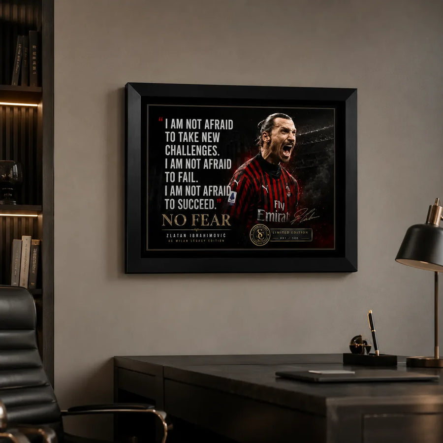 Zlatan Ibrahimovic soccer wall art in a black frame displayed above a desk in a modern office setting.