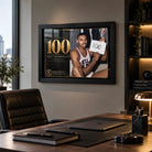 Wilt Chamberlain wall art displayed in a modern office above a desk, presented in a black frame for basketball fans.