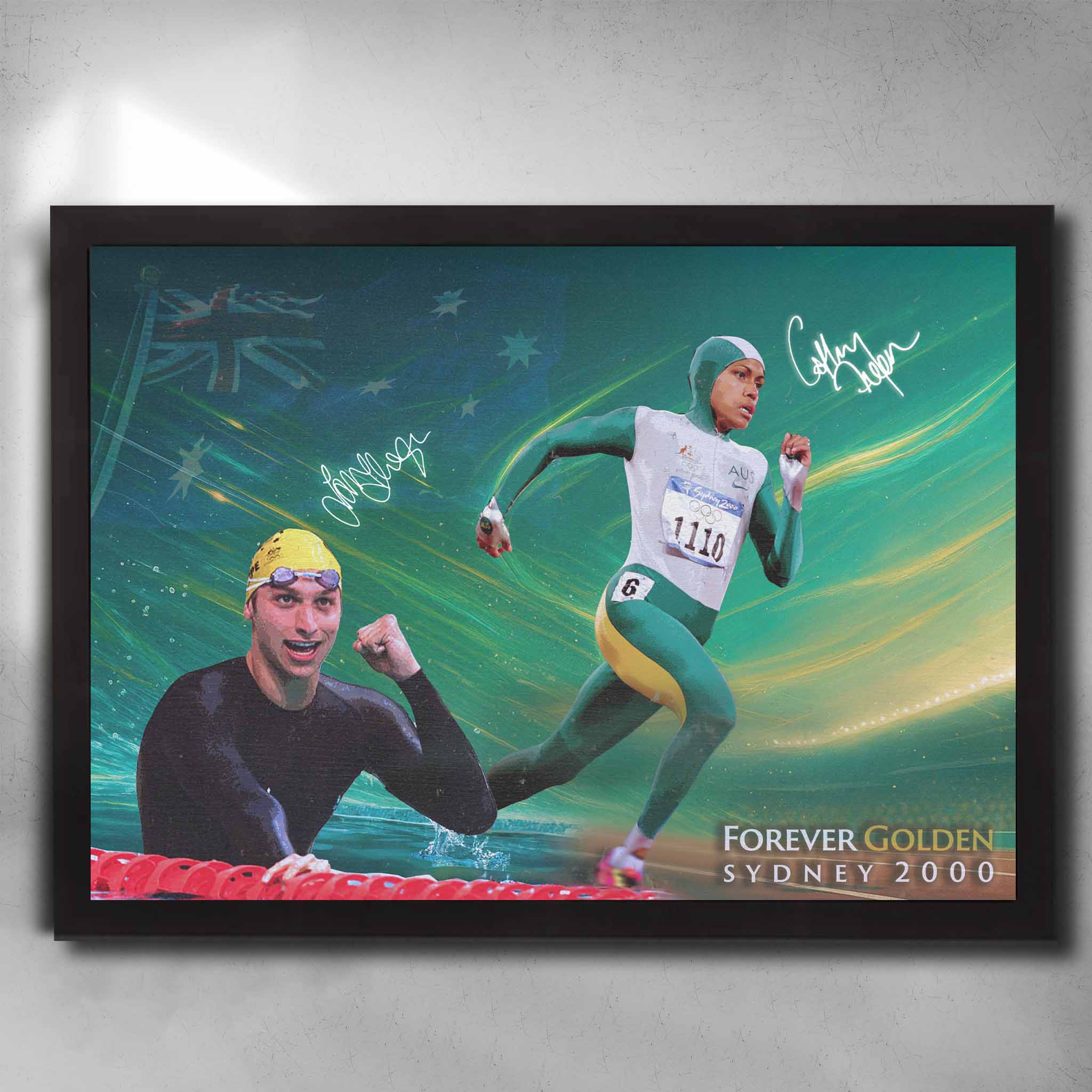 Framed Sydney 2000 Olympics wall art featuring Cathy Freeman and Ian Thorpe in green and gold tribute design.