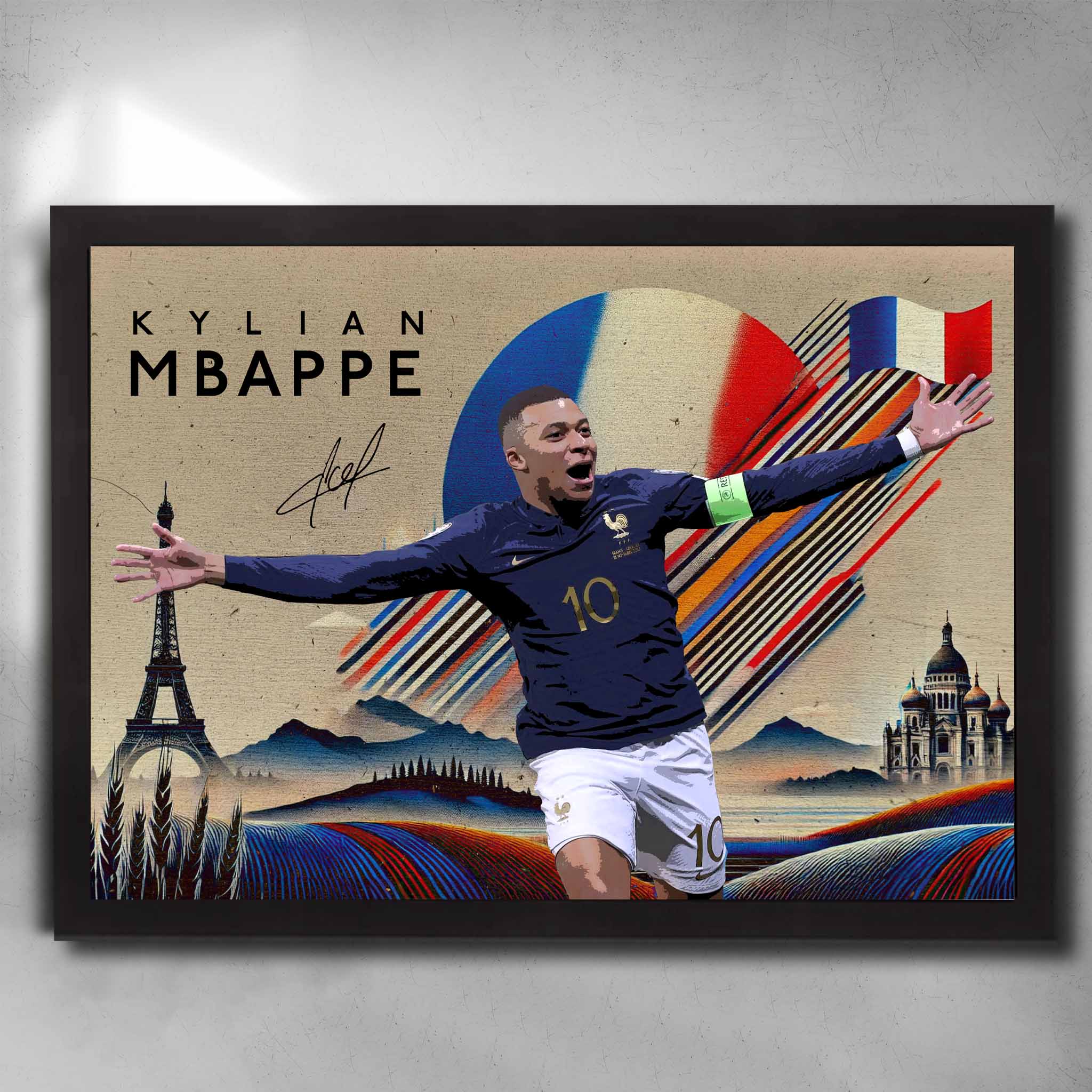 Framed Kylian Mbappé France wall art featuring celebration pose, French flag colors, Eiffel Tower, and artistic background elements.