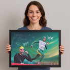 Woman holding framed sports art of Cathy Freeman and Ian Thorpe, a premium sports collectible from www.sportscaveshop.com.