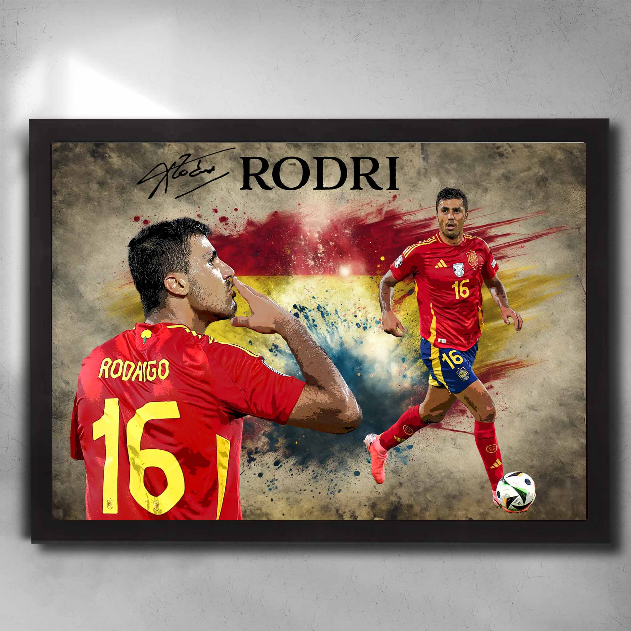 Framed Rodri Spain wall art featuring two dynamic poses, Spain national kit, and patriotic paint-splashed background.
