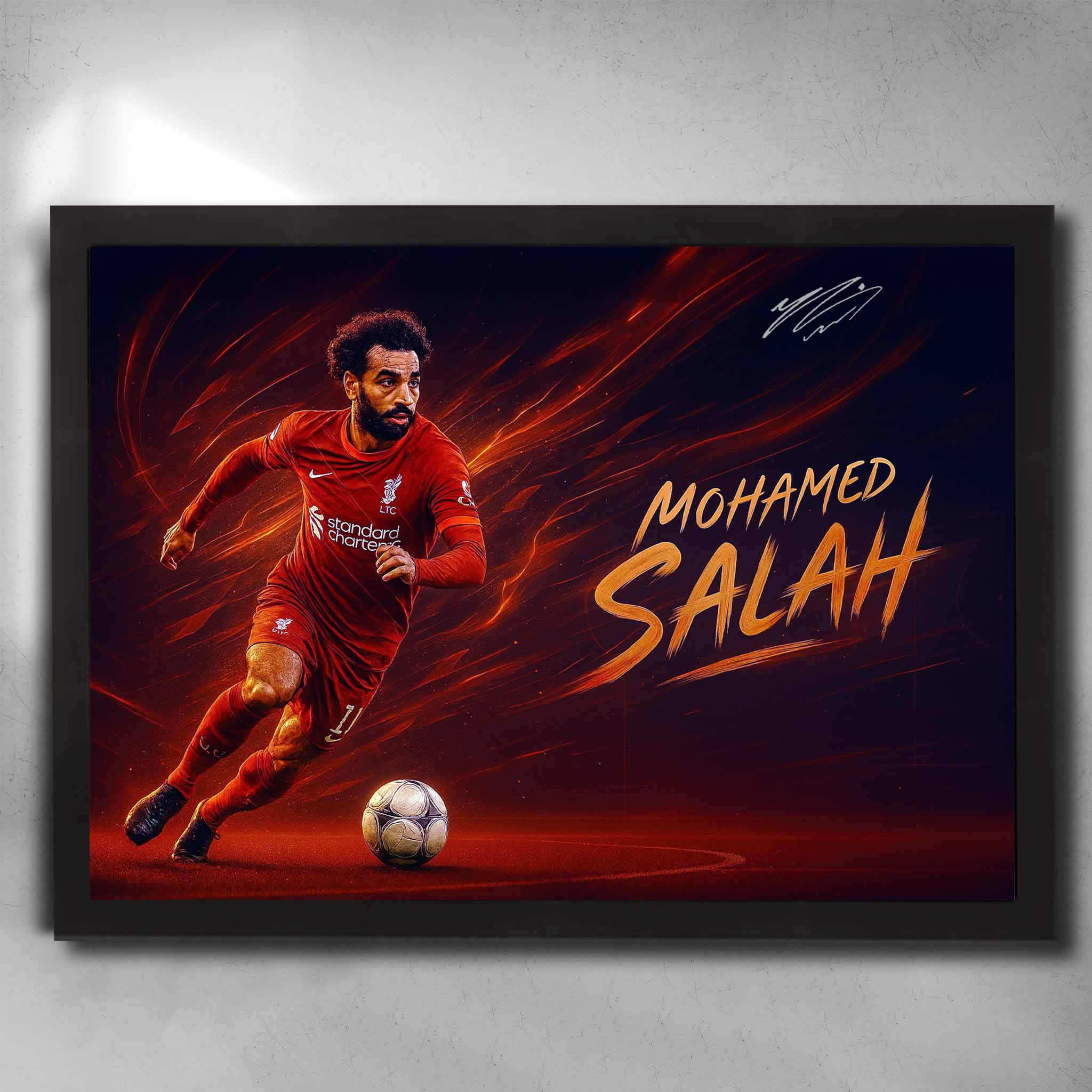 Framed Mohamed Salah Liverpool wall art showing Salah in motion with fiery background and dynamic football design.