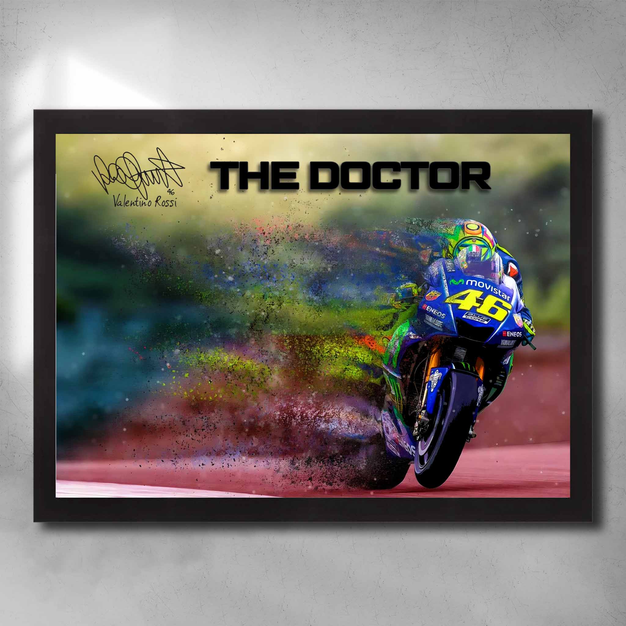 Framed Valentino Rossi wall art featuring MotoGP racing scene, vibrant paint burst effects, and Rossi’s iconic #46 and signature.