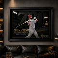 Black framed Albert Pujols 700 baseball wall art displayed in a dark premium man cave with focused lighting.