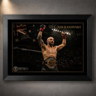 Black framed Alexander Volkanovski wall art featuring the UFC champion with raised fists and title belt.