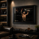 Black framed Alexander Volkanovski UFC artwork displayed in a dark collector-style man cave.