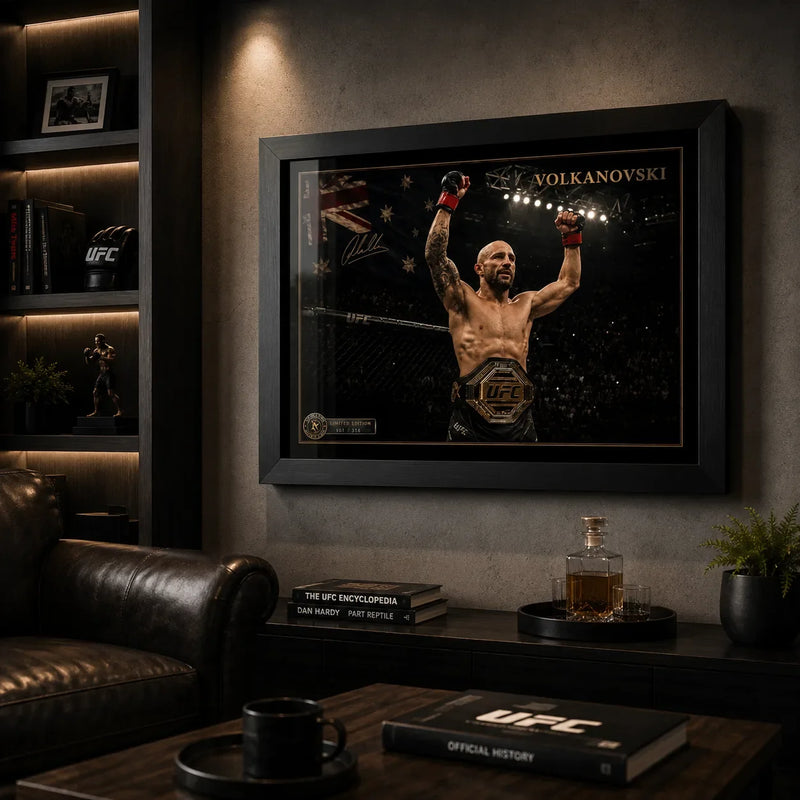 Black framed Alexander Volkanovski UFC artwork displayed in a dark collector-style man cave.