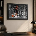 Allen Iverson crossover wall art in a black frame on an office wall beside a desk and leather chair.