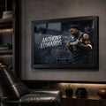 Anthony Edwards framed basketball artwork displayed in a dark sports cave with leather seating.